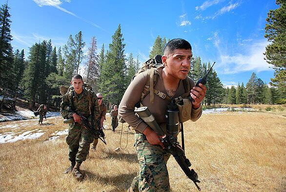 Marines head out on patrol during training exercises at the Marine Corps Mountain Warfare Training Center. The mountainous terrain prepares Marines for Afghanistan's cold, snowy winters, rugged landscape where communication is difficult and high altitudes where breathing is labored and the trajectory of bullets is difficult to gauge.