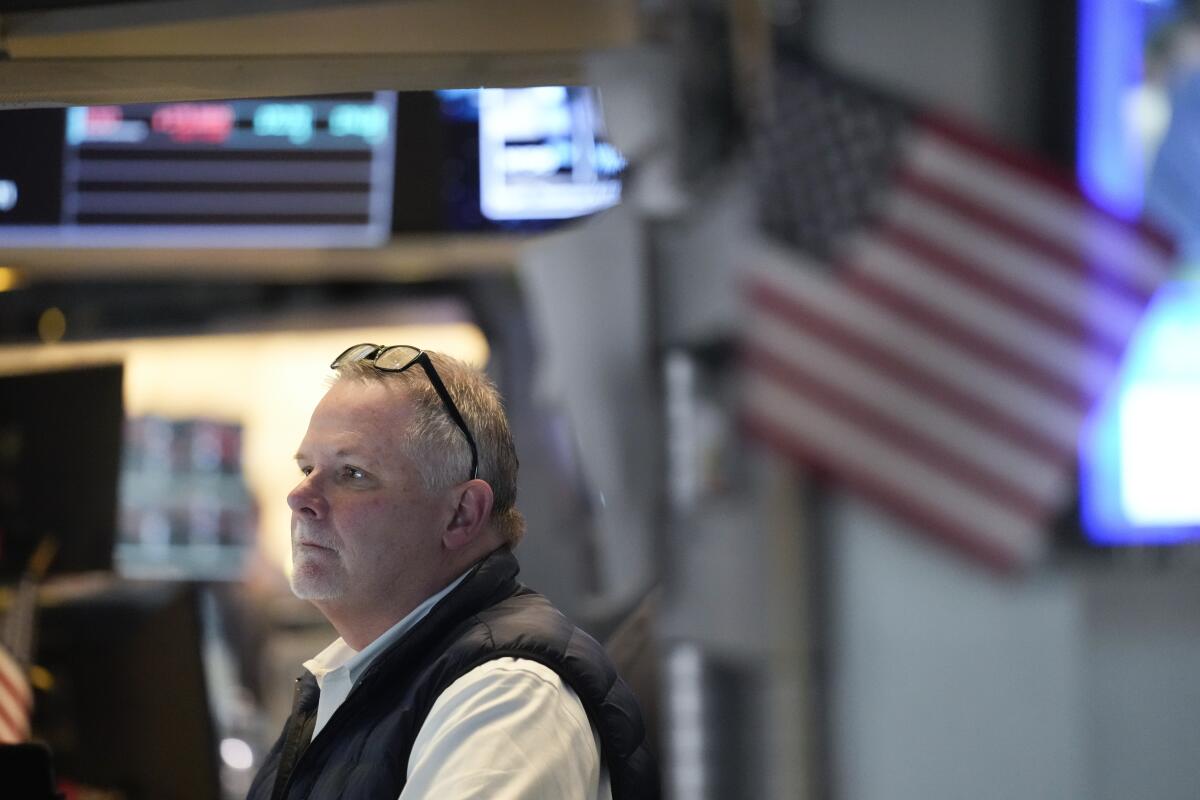 Traders work on the New York Stock Exchange floor 
