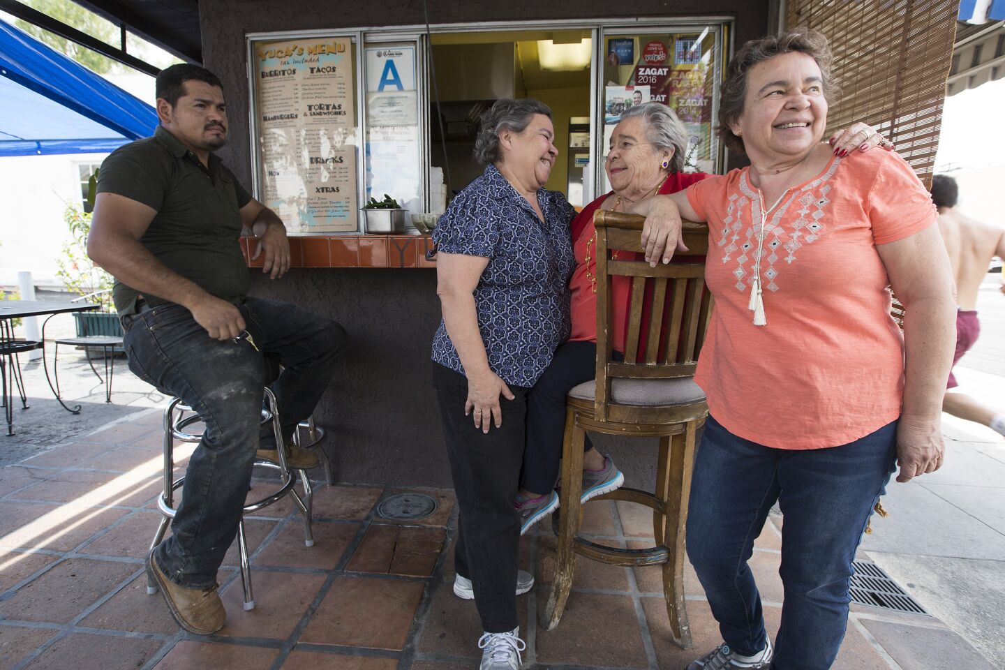 Soccoro Herrera, center, with daughters Dora, left, and Margarita, right, at Yuca's.