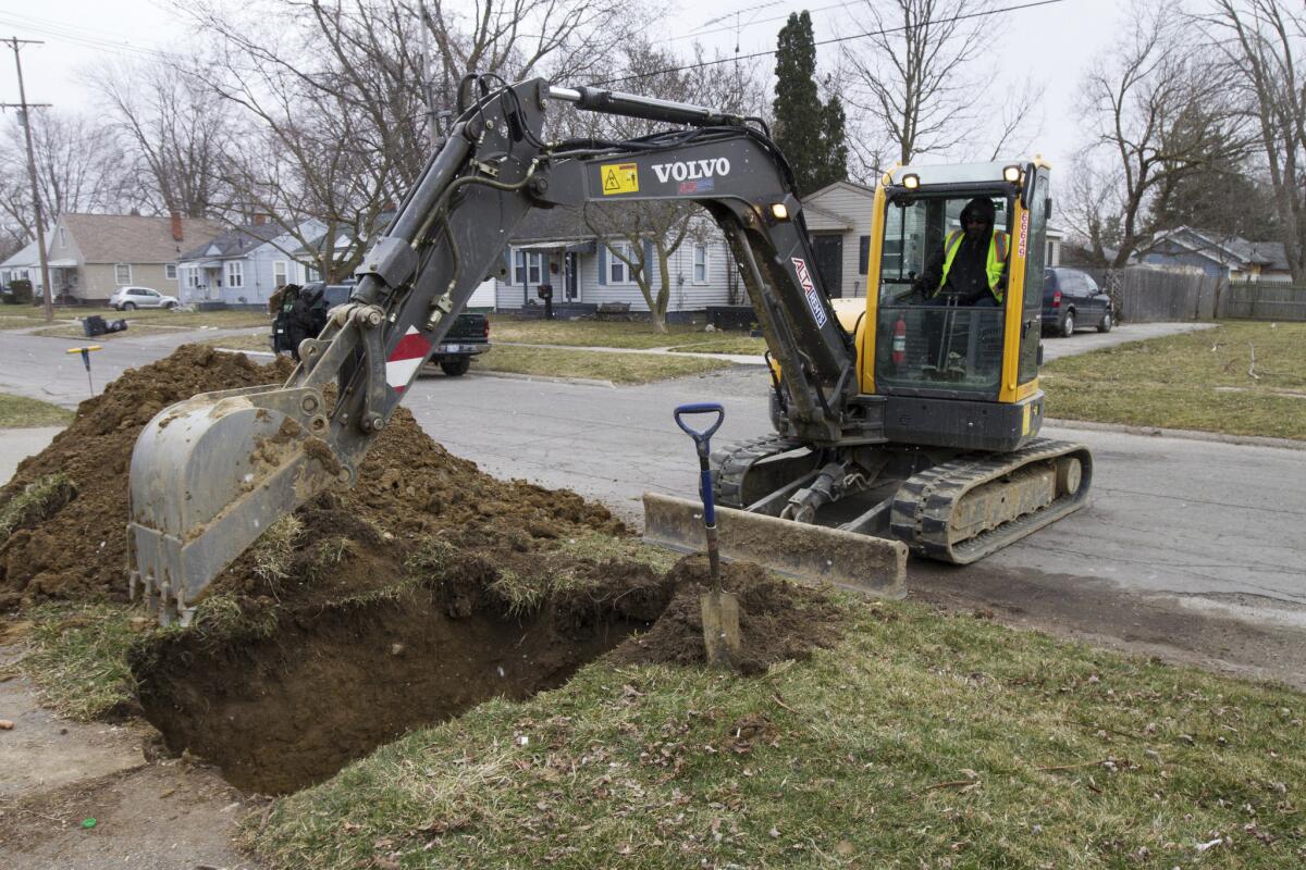 Work continues on replacing water lines in Flint, Mich. on March 10.