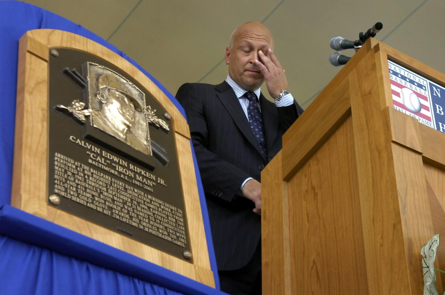 Cal Ripken Jr. makes his Hall of Fame induction speech, wiping away tears when he started to talk about his family.