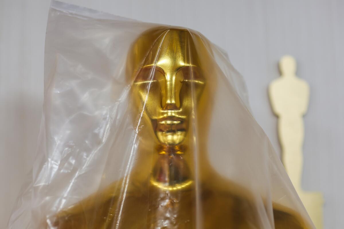 An Oscar statue wrapped in plastic 