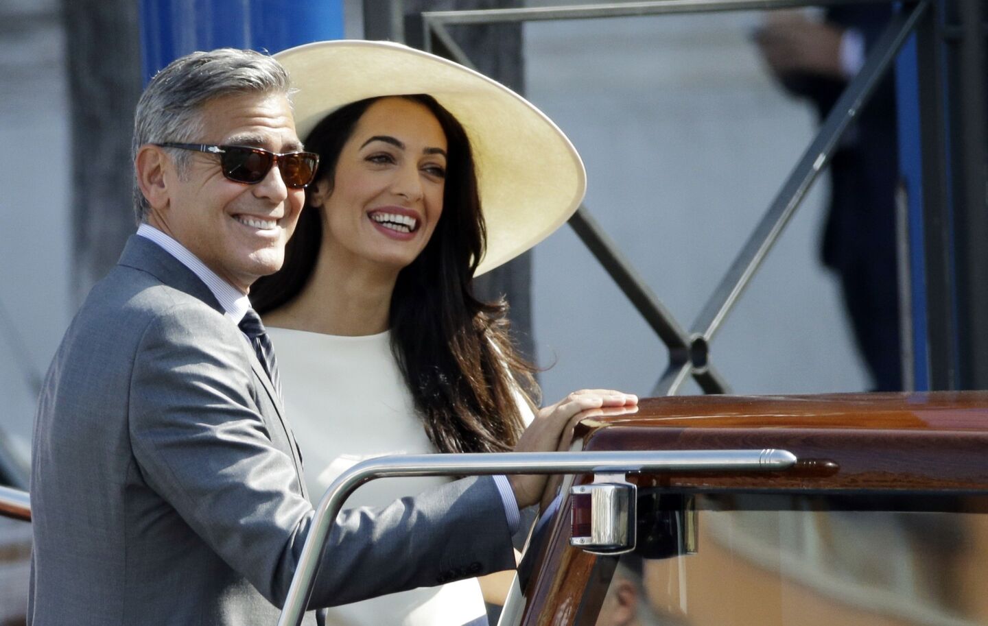 George Clooney and Amal Alamuddin leave Venice's city hall after a civil service to make their Saturday-night marriage legal.