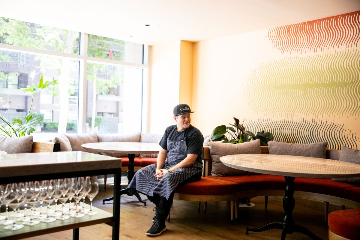 Chef Travis Swikard poses for a portrait at his new East Village restaurant Callie.
