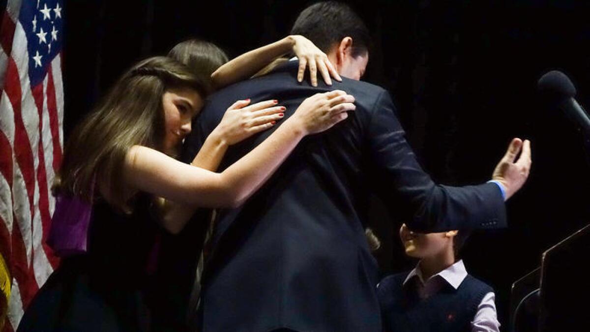 Marco Rubio is consoled by his family Tuesday after he dropped out of the Republican race for president.