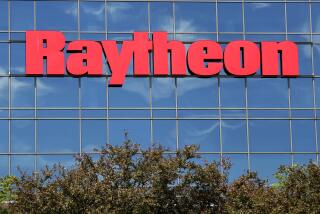 FILE - The sky is reflected on the facade of Raytheon's Integrated Defense Systems facility, Monday, June 10, 2019, in Woburn, Mass. (AP Photo/Elise Amendola, File)