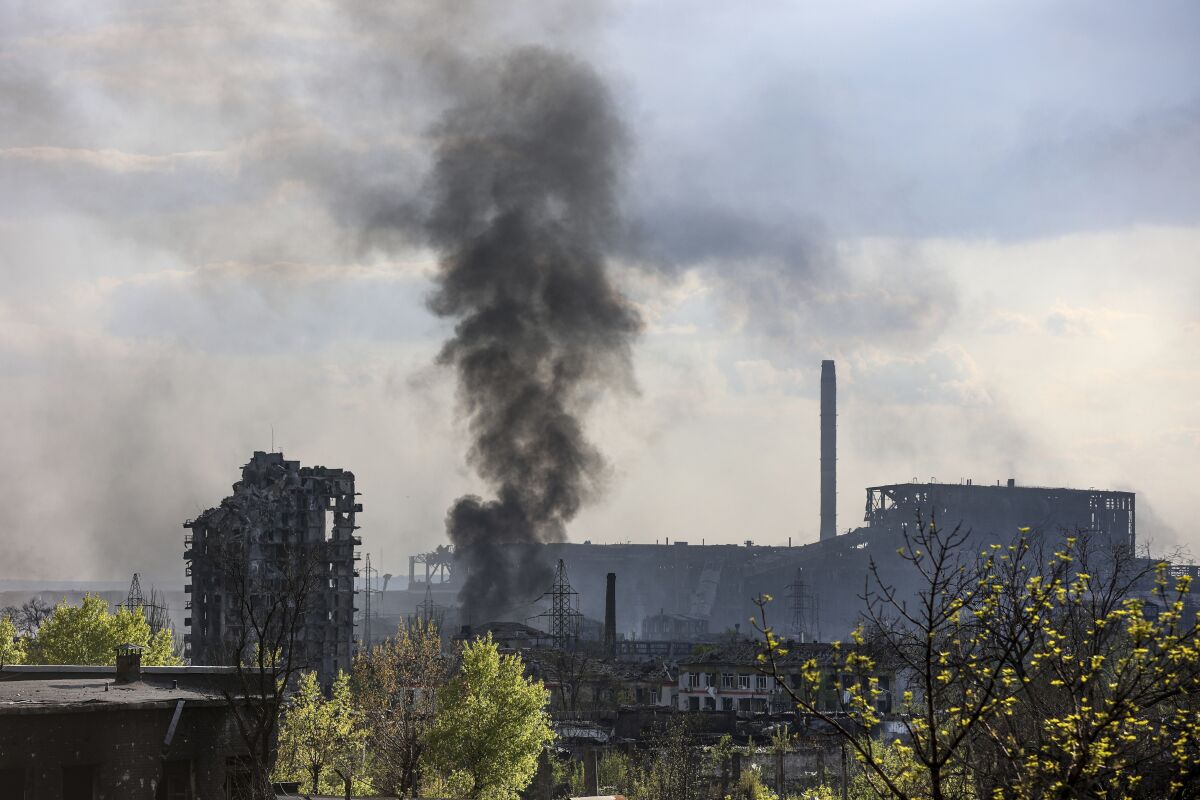 Smoke rising from besieged steel plant in Ukraine