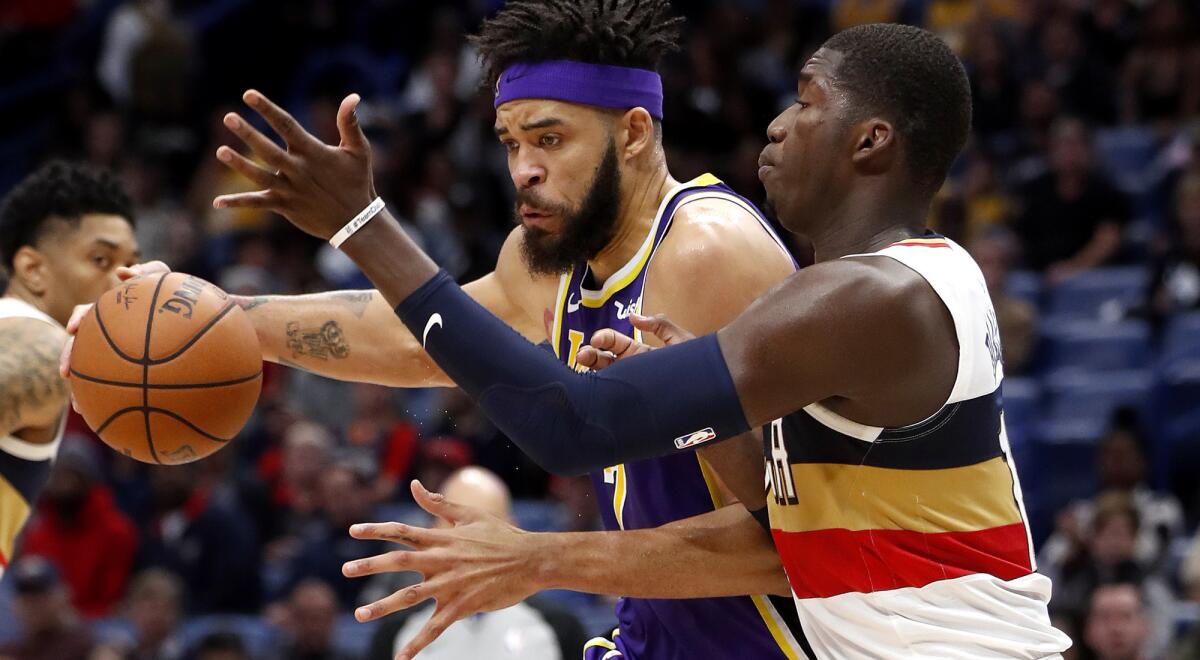 Lakers center JaVale McGee goes for 23 points and 16 rebounds against forward Cheick Diallo and the Pelicans on Sunday.