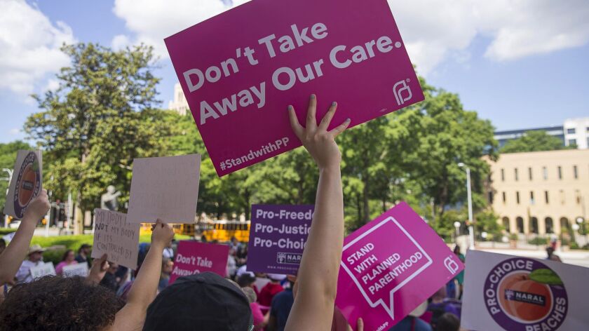 Protesters rally at the Georgia state Capitol in Atlanta this month after Gov. Brian Kemp signed legislation banning abortions at about six weeks.