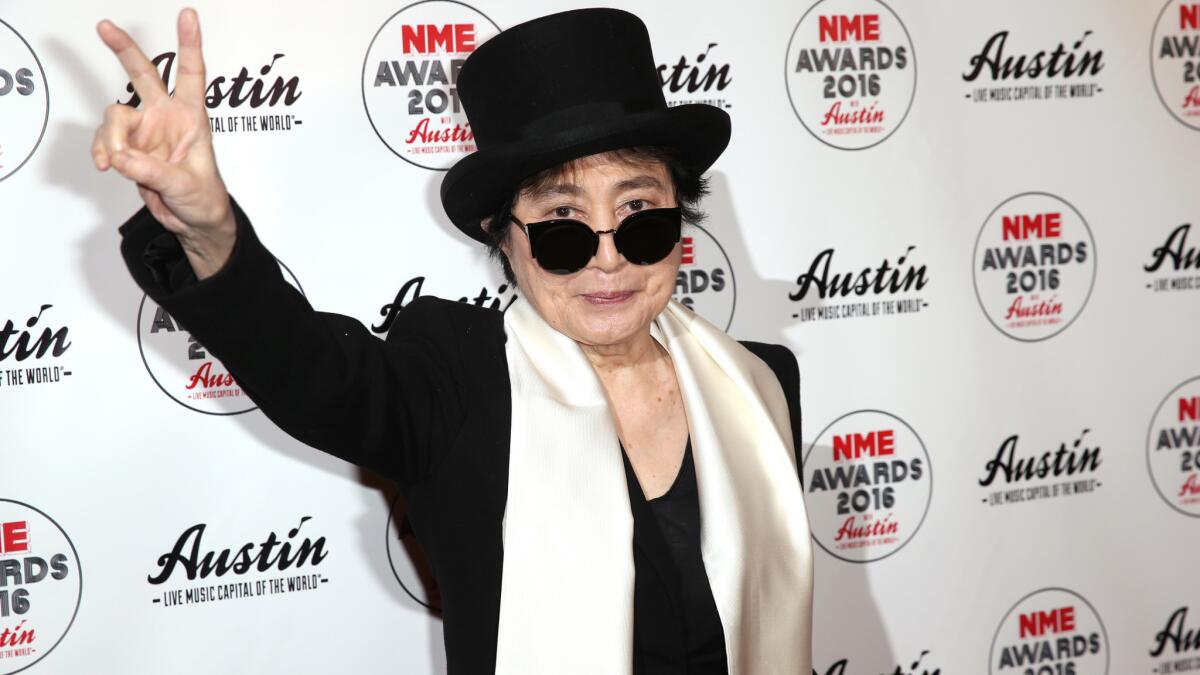 Yoko Ono poses for photographers upon arrival at the NME 2016 music awards in London on Wednesday, Feb. 17, 2016.