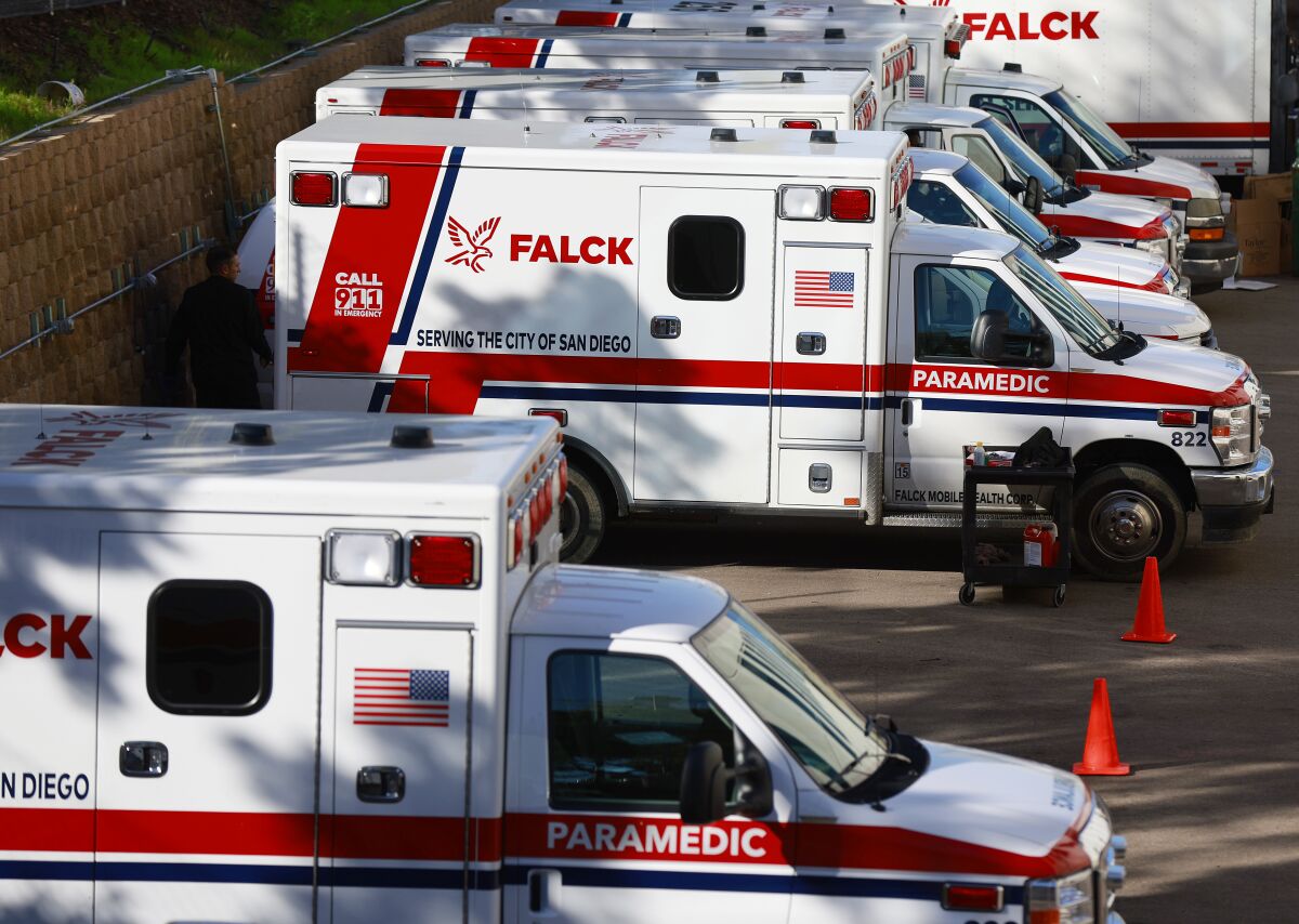 A row of parked Falck ambulances
