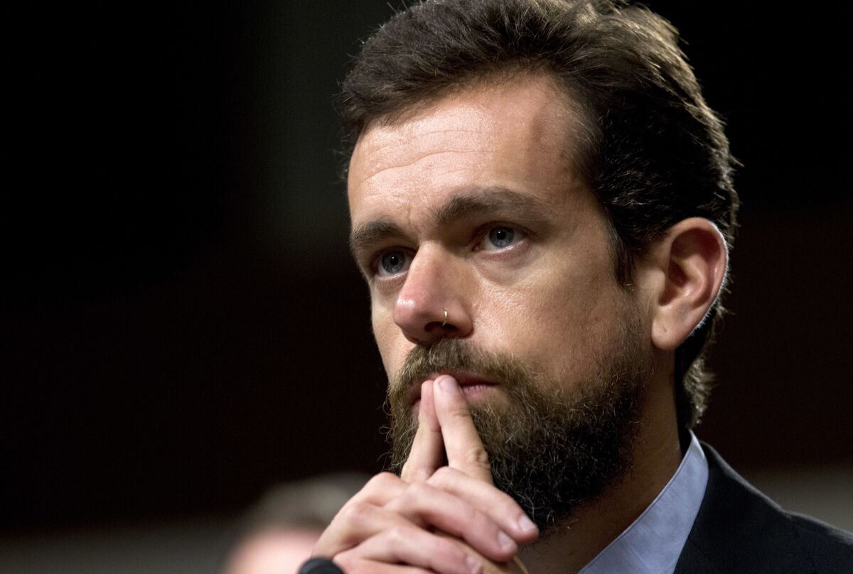 Twitter Chief Executive Jack Dorsey has his fingers under his chin. 