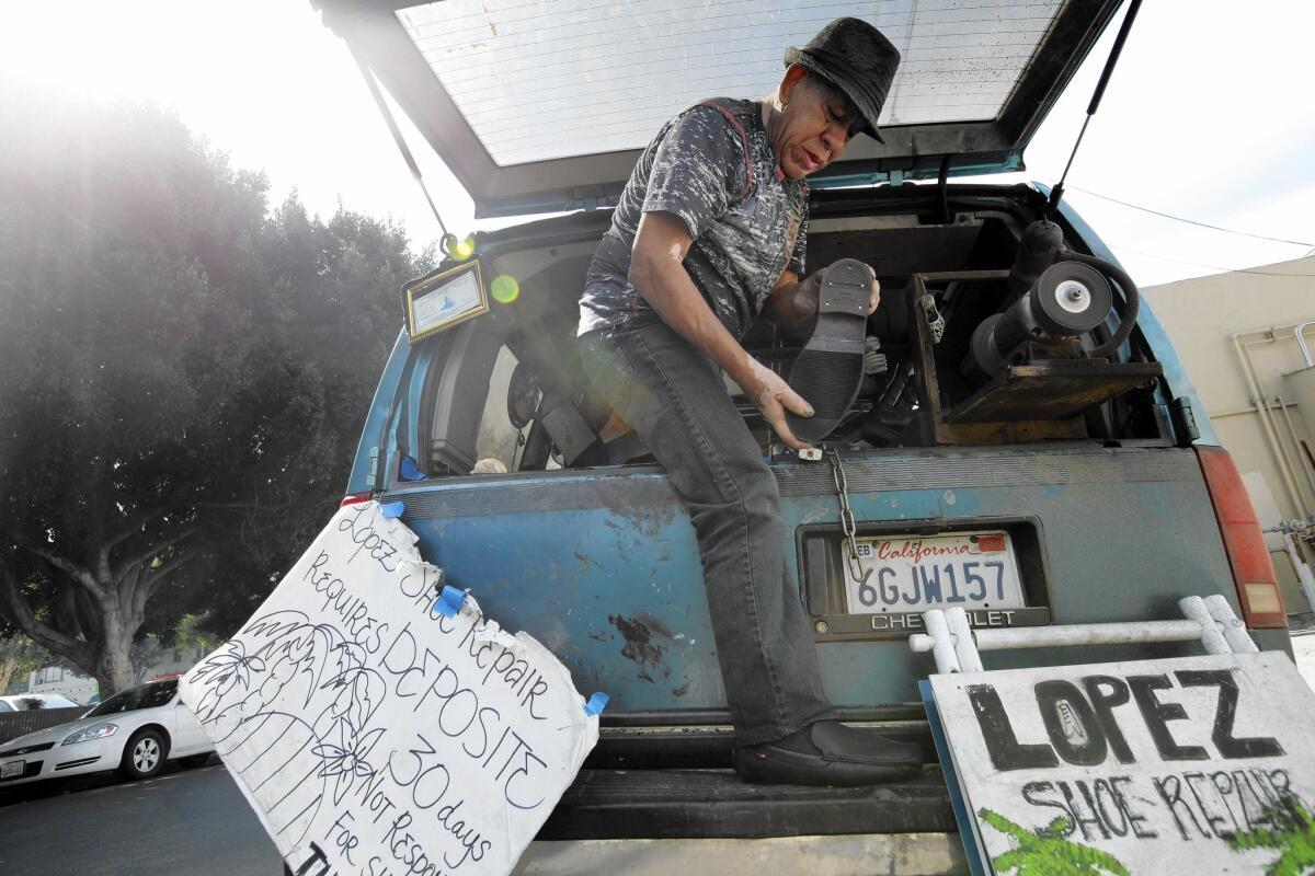 Rafael Lopez runs a shoe-repair business out of one van and lives in another.