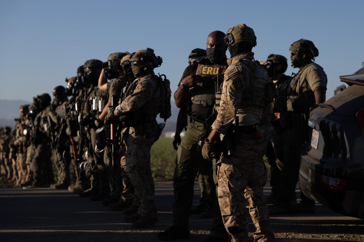 Federal agents form a line