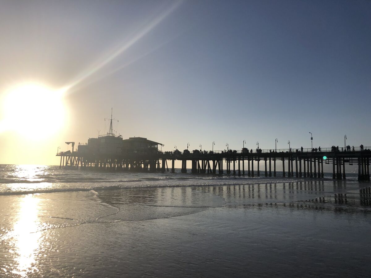 The Santa Monica Pier at low tide.