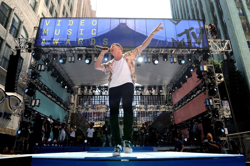 Macklemore rehearses for MTV's Video Music Awards.