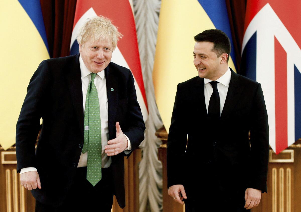Britain's Prime Minister Boris Johnson, left, and Ukrainian President Volodymyr Zelensky