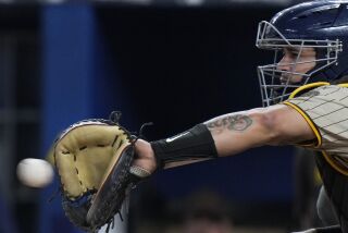 San Diego Padres catcher Gary Sanchez catches a pitch during the first inning of a baseball game against the Miami Marlins, Wednesday, May 31, 2023, in Miami. (AP Photo/Wilfredo Lee)