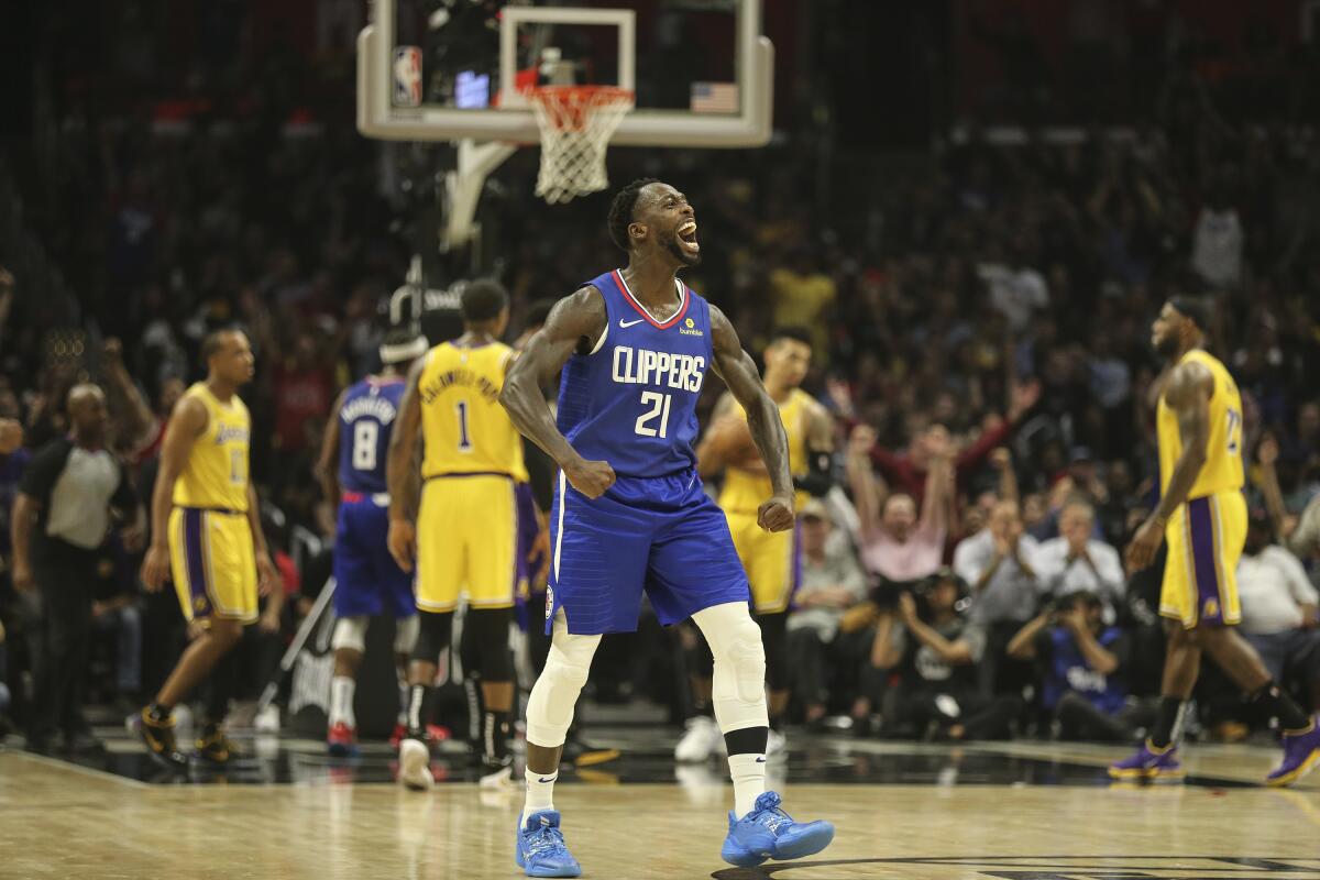 Clippers guard Patrick Beverley (21) celebrates during the fourth quarter of a victory over the Lakers on Tuesday night.