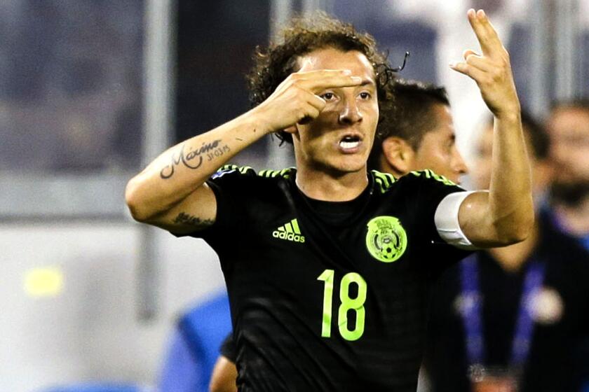 Mexico's Andres Guardado (18) celebrates after scoring the only goal of the game against Costa Rica on a penalty kick in extra time Sunday night.