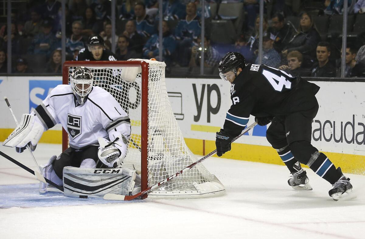 Kings goalie Jhonas Enroth blocks a shot by Sharks center Tomas Hertl in the third period Thursday night in San Jose.