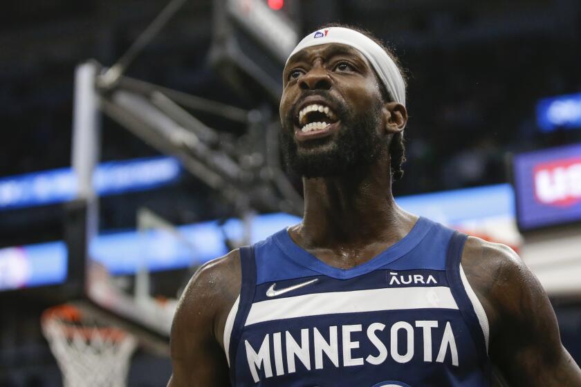 Minnesota Timberwolves guard Patrick Beverley yells during an NBA basketball game.