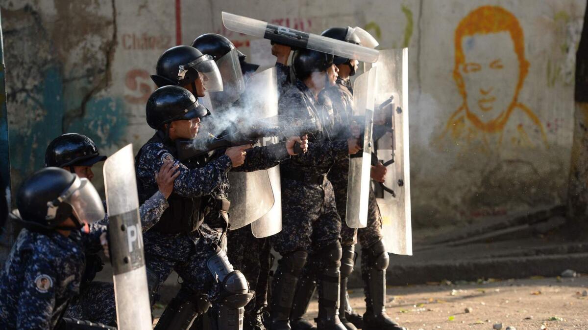 Venezuelan riot police clash with anti-government demonstrators in Los Mecedores neighborhood in Caracas on Jan. 21, 2019.