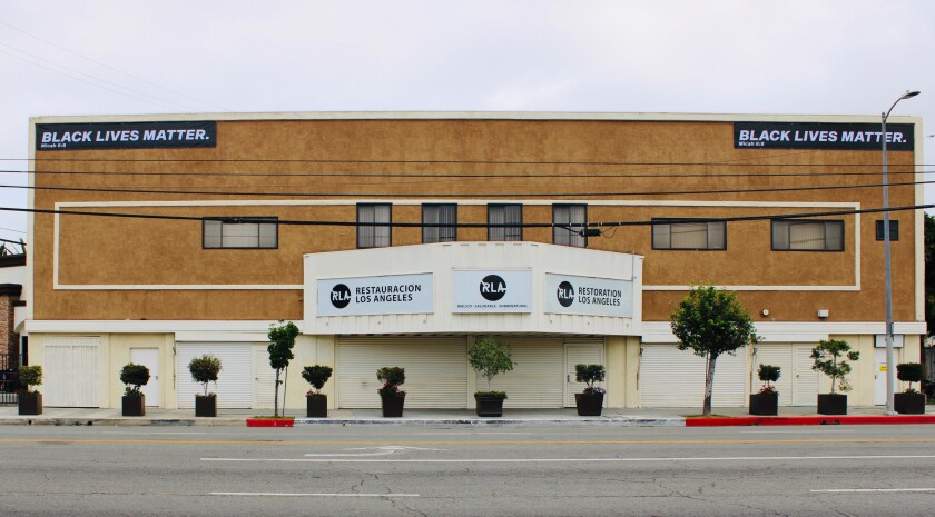 Iglesia Restauración, a Latino church in West Adams, hung two Black Lives Matter banners.