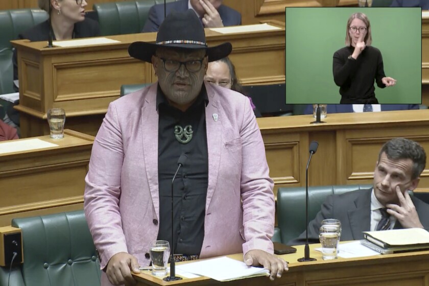In this image from video, Indigenous New Zealand lawmaker Rawiri Waititi speaks in Parliament in Wellington, New Zealand, Wednesday, May 12, 2021. Waititi was thrown out of Parliament's debating chamber later for performing a Maori haka in protest at what he said were racist arguments. Waititi's stance came after ongoing debate among lawmakers about the government's plans to set up a new Maori Health Authority as part of sweeping changes to the health care system. (NZ Parliament TV via AP)