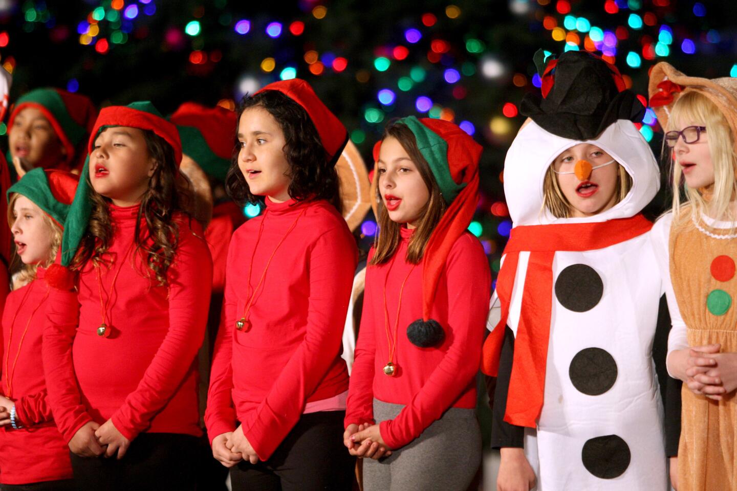 Students from Columbus Elementary School sang Christmas songs at the tree lighting ceremony at Perkins Plaza in Glendale on Wednesday, Dec. 2, 2015.
