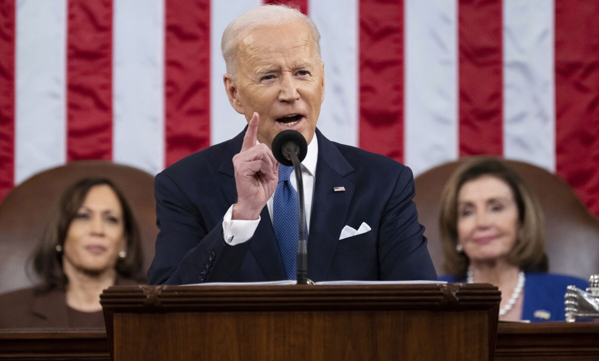 President Joe Biden delivers his first State of the Union address to a joint session of Congress at the Capitol, as Vice President Kamala Harris and House Speaker Nancy Pelosi of Calif., watch, Tuesday, March 1, 2022, in Washington. Biden has a new plan to expand mental health and drug abuse treatment. He proposes pouring hundreds of millions of taxpayer dollars into suicide prevention, mental health services for youth, and community clinics providing 24/7 access to people in crisis. (Saul Loeb/Pool via AP)
