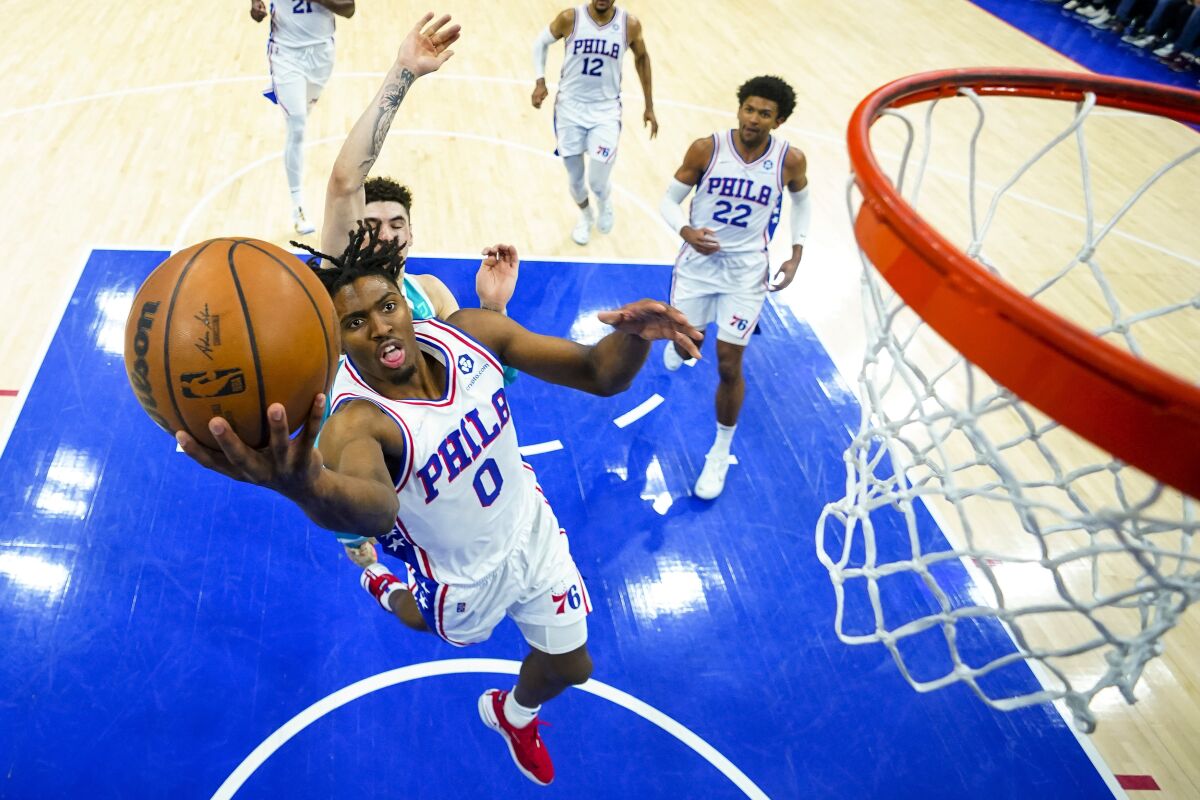 Philadelphia 76ers' Tyrese Maxey goes up for the shot during the first half of an NBA basketball game against the Charlotte Hornets, Saturday, April 2, 2022, in Philadelphia. (AP Photo/Chris Szagola)