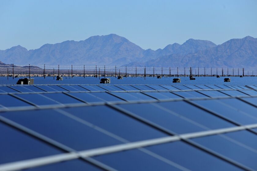 Photo-voltaic solar cells soak in the afternoon sun at the new 550-megawatt Desert Sunlight Solar Farm, in Desert Center, Calif. The project is one of the world's largest photo-voltaic solar farms on 3,800 acres of federal land in Riverside County.