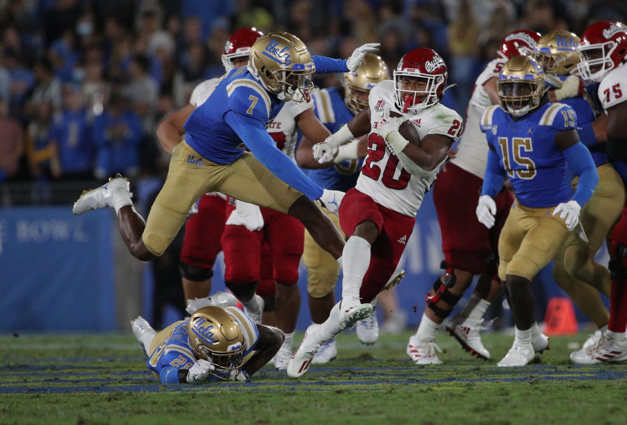Fresno State's  running back Ronnie Rivers  finds a gap in the Bruin defense.