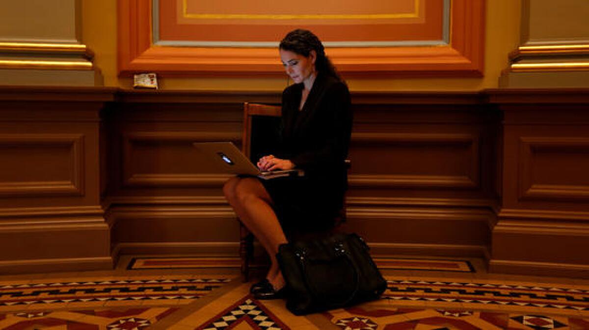 Bernadette Del Chiaro, executive director of the California Solar Energy Industries Assn., works in the rotunda at the Capitol.