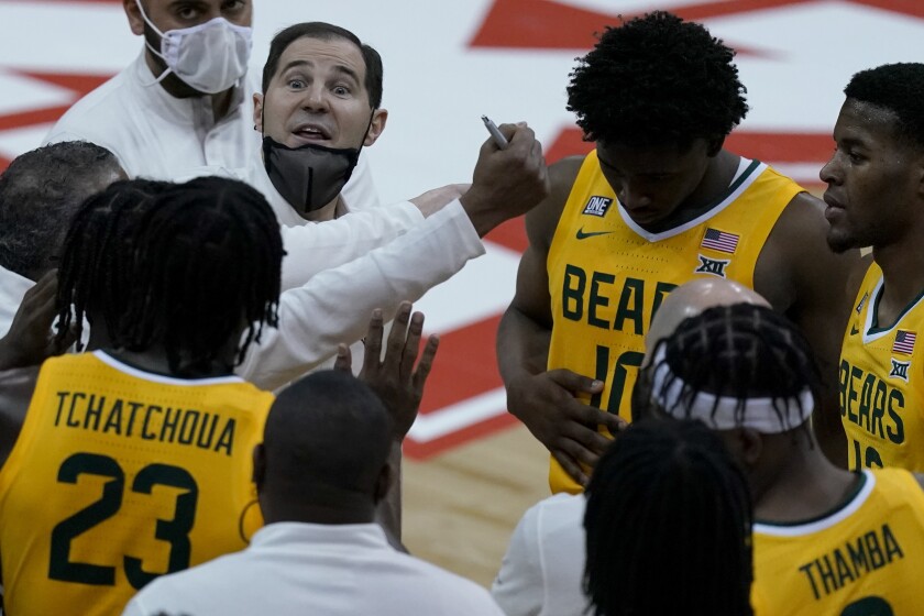 Baylor head coach Scott Drew talks to his team during the second half of an NCAA college basketball game against Oklahoma State in the semifinals of the Big 12 tournament in Kansas City, Mo., Friday, March 12, 2021. (AP Photo/Charlie Riedel)