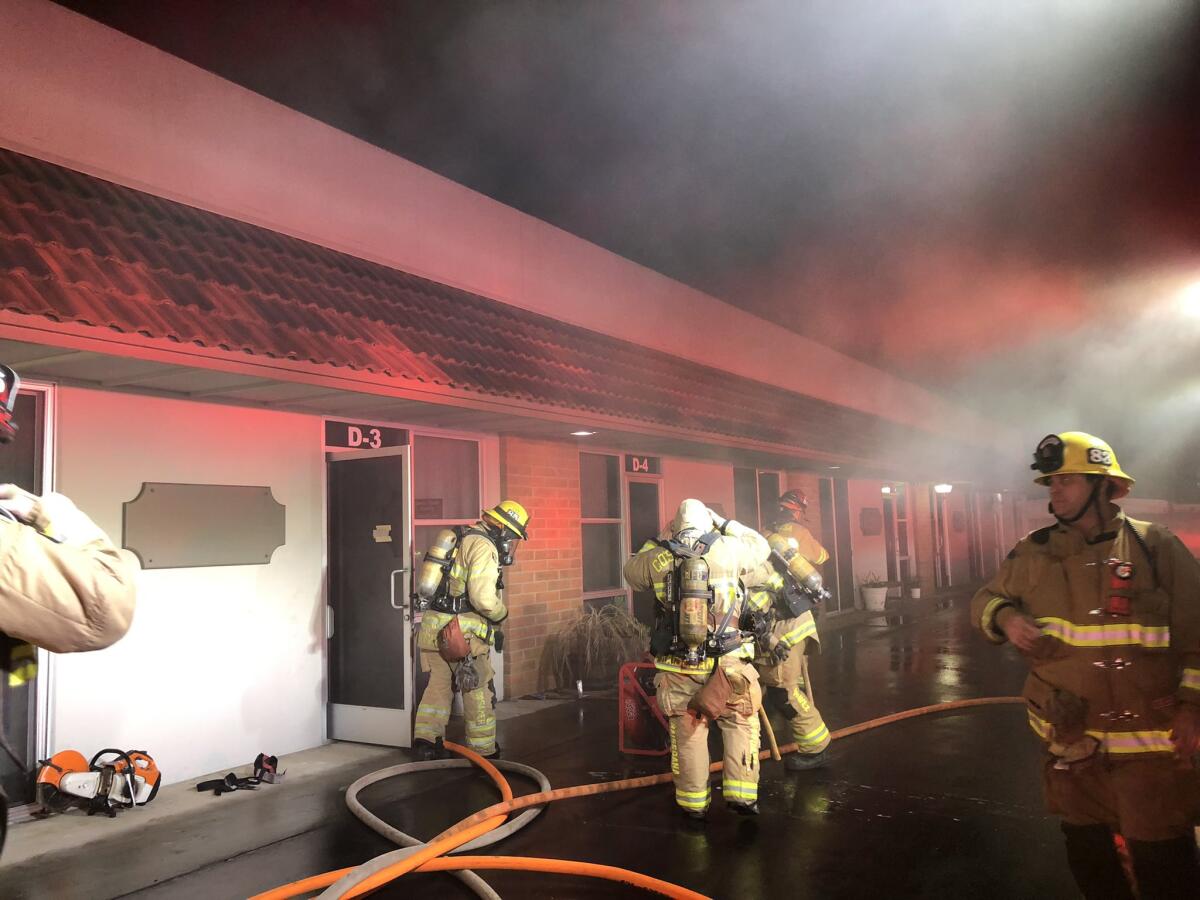 Costa Mesa firefighters work to extinguish a blaze. 