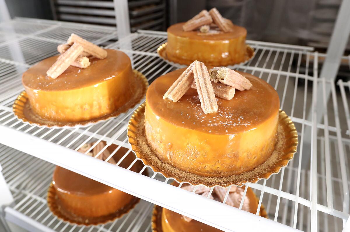 Cakes of Mexican flan on display in the store's bakery during opening day at Mercado González.