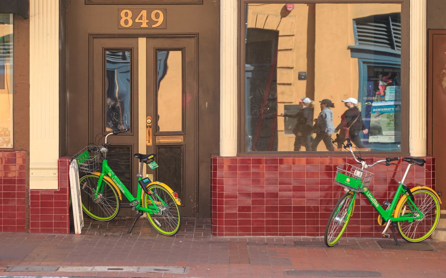 These are two LimeBike bikes along 4th Avenue.