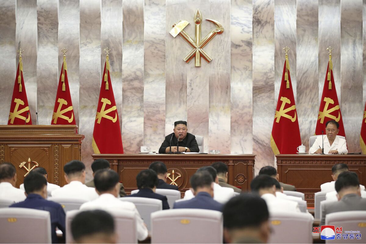 In this photo provided by the North Korean government, North Korea leader Kim Jong Un speaks during a Workers’ Party meeting in Pyongyang, North Korea, Tuesday, Sept. 8, 2020. Kim during the high-level political conference called for urgent efforts to rebuild thousands of homes and other structures destroyed by Typhoon Maysak that slammed the country’s eastern region last week, state media said Wednesday, Sept. 9. Independent journalists were not given access to cover the event depicted in this image distributed by the North Korean government. The content of this image is as provided and cannot be independently verified. Korean language watermark on image as provided by source reads: "KCNA" which is the abbreviation for Korean Central News Agency. (Korean Central News Agency/Korea News Service via AP)