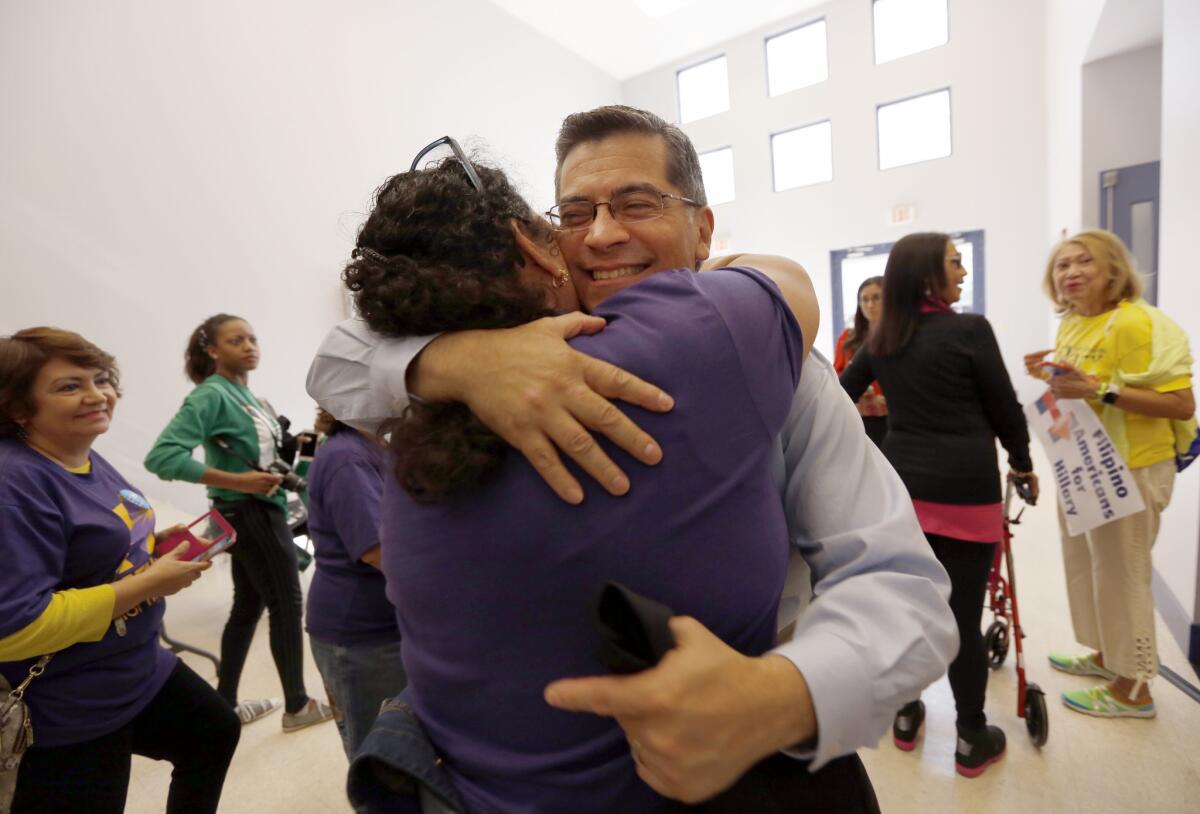 HENDERSON, NV - Xavier Becerra, (D-CA), California's Congressman and Chairman of the House Democratic Caucus, is embraced by a SEIU member after the Hillary Clinton rally at Painter's Hall in Henderson, NV. (Francine Orr/ Los Angeles Times)