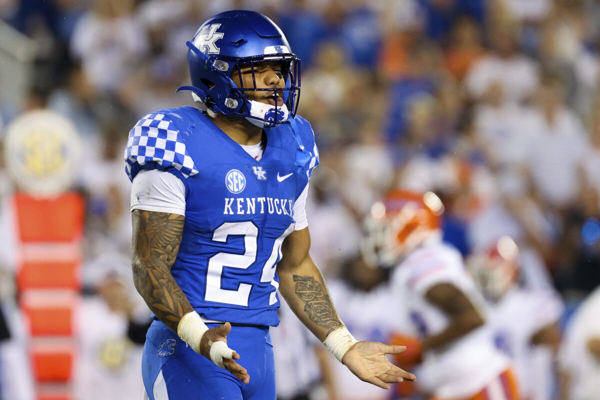 Kentucky running back Chris Rodriguez Jr. (24) complains about a call during the second half of an NCAA college football game against Florida in Lexington, Ky., Saturday, Oct. 2, 2021. (AP Photo/Michael Clubb)