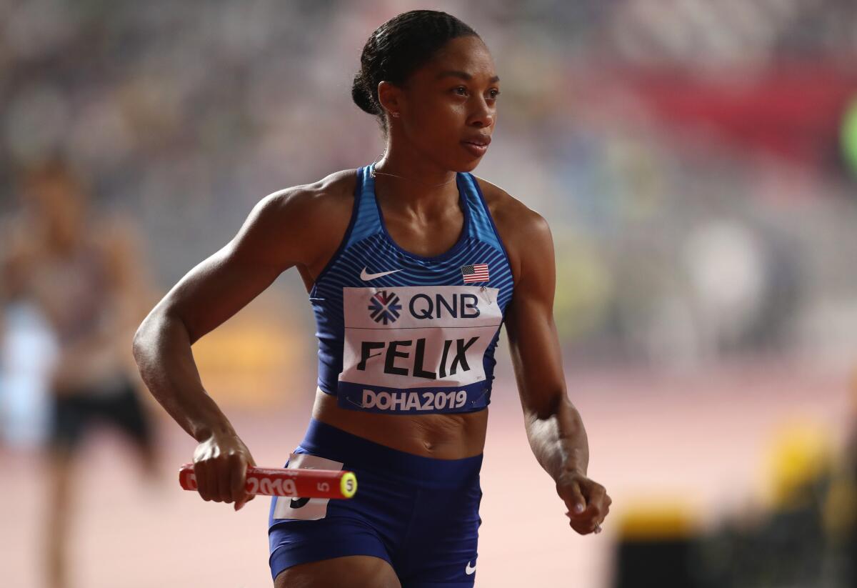 Allyson Felix competes in the 400-meter relay at the IAAF World Athletics Championships on Sunday.
