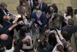 Speaker of the House Kevin McCarthy, R-Calif., is surrounded by reporters looking for updates on plans to fund the government and avert a shutdown, at the Capitol in Washington, Friday, Sept. 22, 2023. (AP Photo/J. Scott Applewhite)