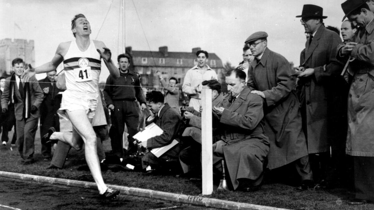 Roger Bannister nears the tape at the end of his record-breaking mile run at Iffley Road, Oxford.