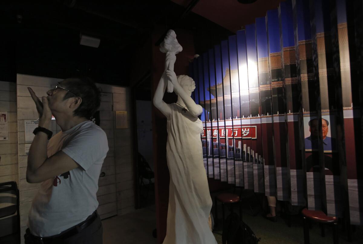 A man examines the exhibits in the June 4th Museum in Hong Kong on April 15, 2016.