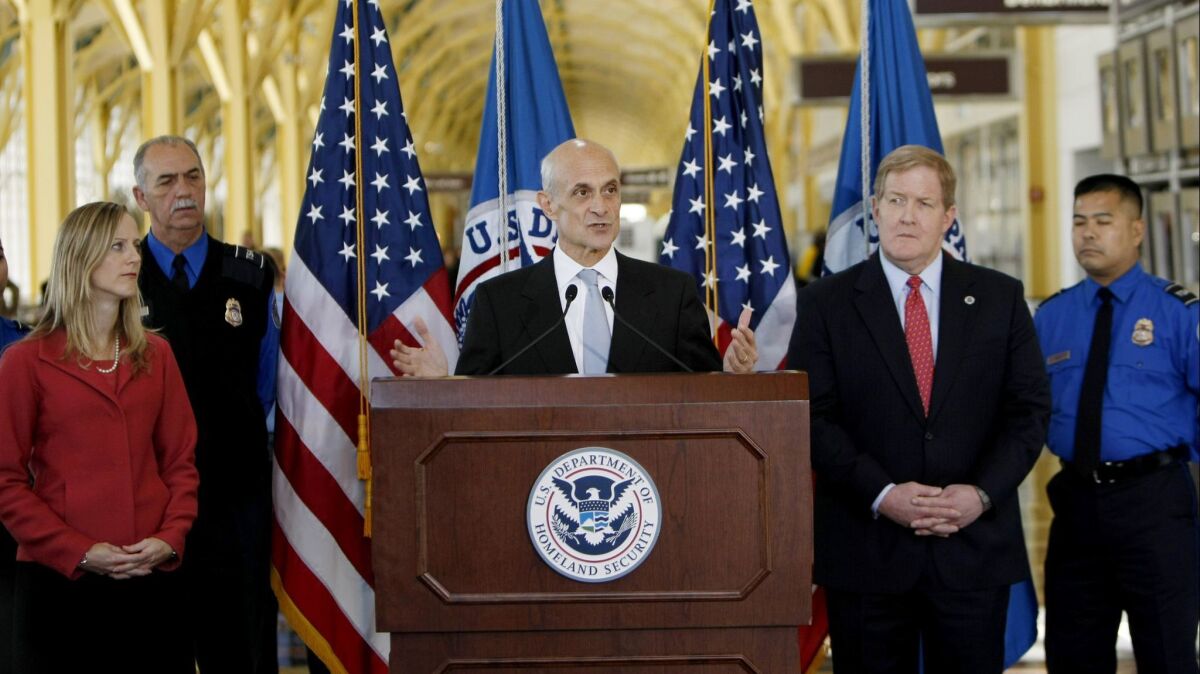 Kathy Kraninger, left, is President Trump's nominee to be director of the Consumer Financial Protection Bureau. She's shown here at a 2008 event when serving as deputy assistant secretary for policy at the Department of Homeland Security,