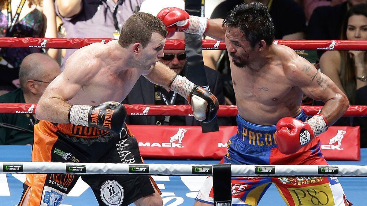 Manny Pacquiao, right, absorbed hard punches from Australian underdog Jeff Horn during their bout in Brisbane.