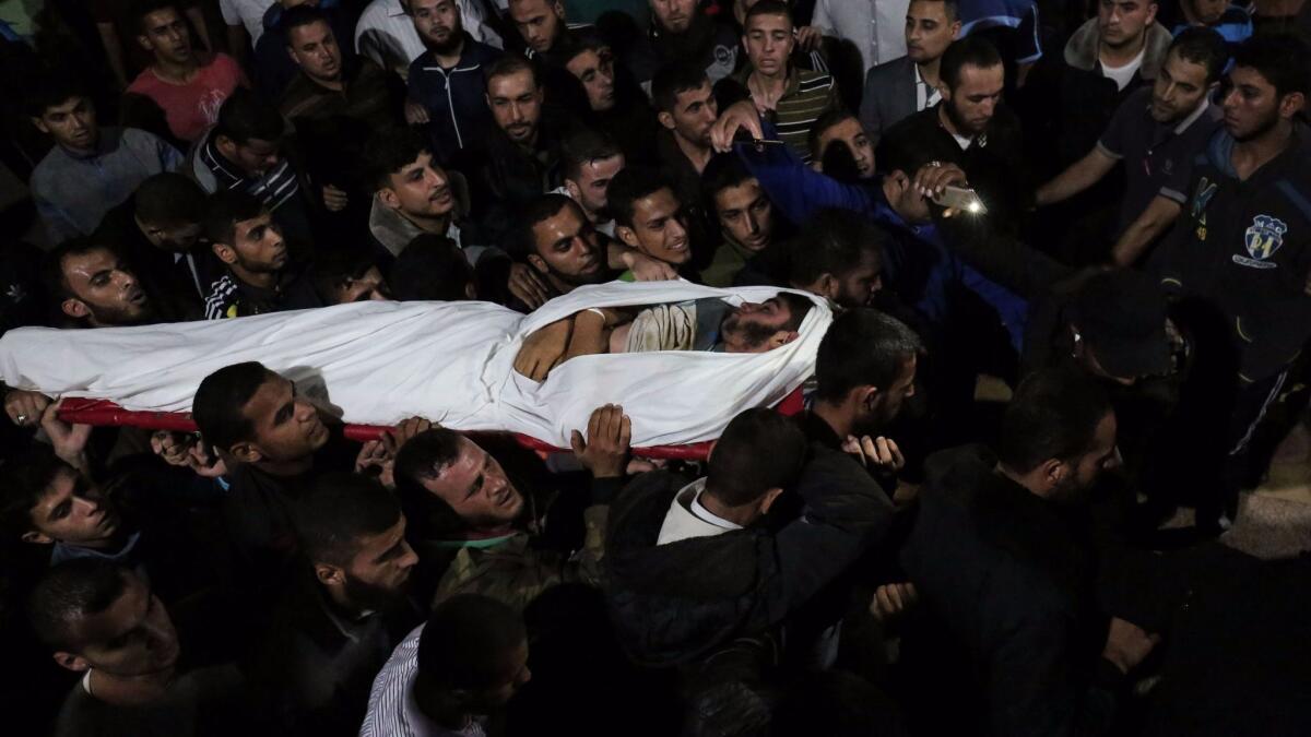 The body of Marwan Alagha, 22, is carried by mourners at Nasser hospital in Khan Yunis, in the southern Gaza Strip, on Oct. 30, 2017. He was killed when Israel blew up what it said was a tunnel stretching from the Gaza Strip into its territory.