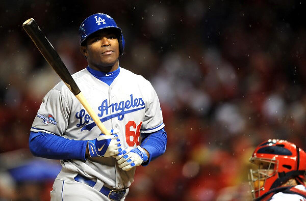 Dodgers right fielder Yasiel Puig reacts after striking out in the eighth inning against the Cardinals in Game 6 on Friday night in St. Louis.